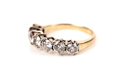 Lot 1159 - A diamond half hoop eternity ring