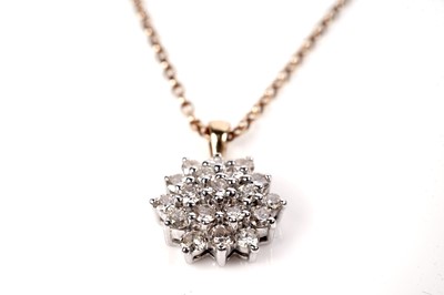 Lot 1160 - A diamond cluster pendant