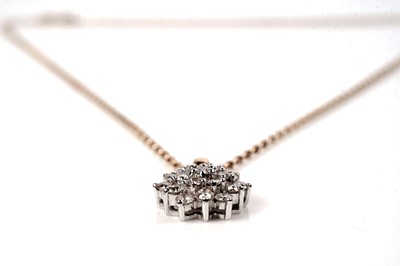Lot 1160 - A diamond cluster pendant