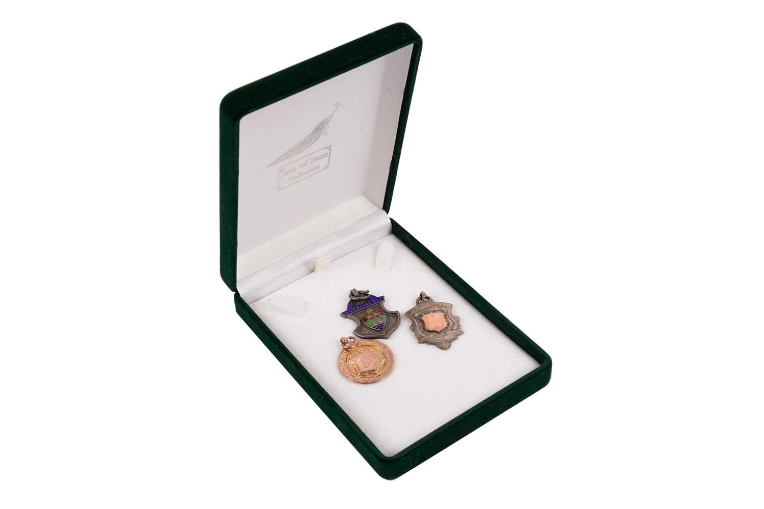 Lot 427 - Two 1920s football medals; and another silver sporting medal