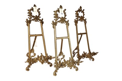 Lot 213 - Three Art Nouveau brass tabletop easels