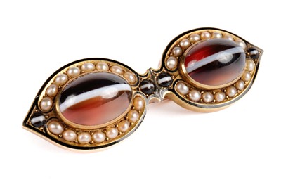 Lot 449 - A Victorian banded agate, seed pearl, enamel and yellow gold brooch