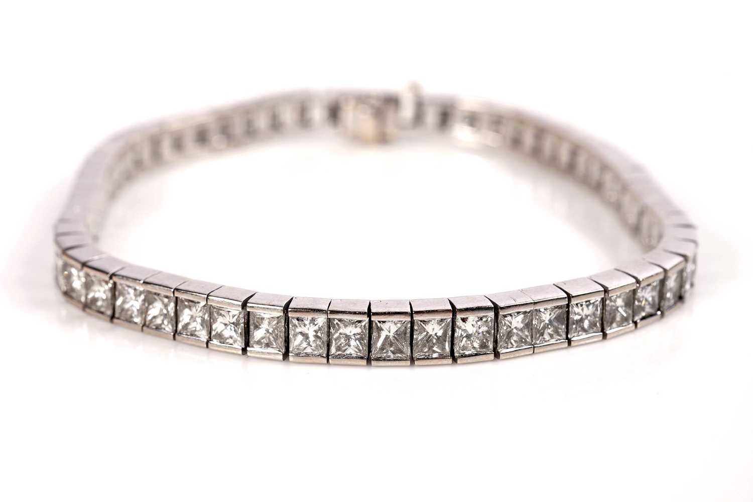 Lot 1161 - A radiant-cut diamond line or 'tennis' bracelet