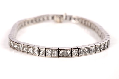 Lot 1161 - A radiant-cut diamond line or 'tennis' bracelet