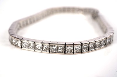 Lot 1161 - A radiant-cut diamond line or 'tennis' bracelet