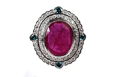 Lot 1166 - A ruby, blue diamond, and diamond dress ring
