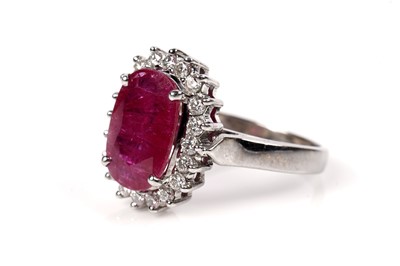 Lot 1169 - A ruby and diamond cluster ring