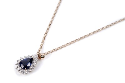 Lot 1170 - A sapphire and diamond cluster pendant