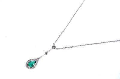 Lot 1182 - An emerald and diamond cluster pendant necklace