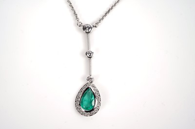 Lot 1182 - An emerald and diamond cluster pendant necklace