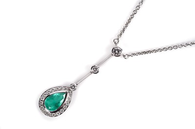 Lot 1182 - An emerald and diamond cluster pendant necklace