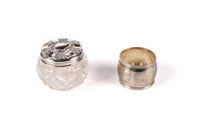 Lot 592 - A George V silver topped cut glass jar; and a silver napkin ring