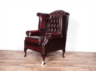 Lot 4 - A 'Saxon' oxblood leather wingback armchair