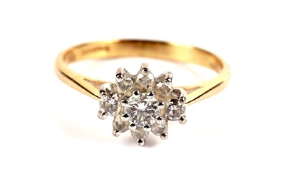 Lot 491 - A diamond flower cluster ring; and a diamond trilogy ring
