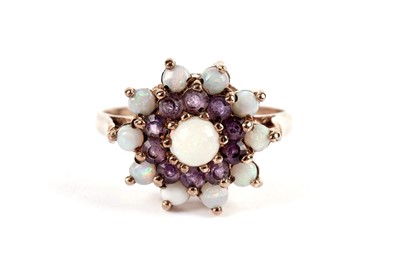 Lot 492 - An opal and amethyst cluster dress ring