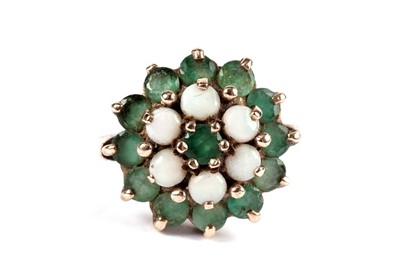 Lot 524 - An emerald and opal cluster dress ring