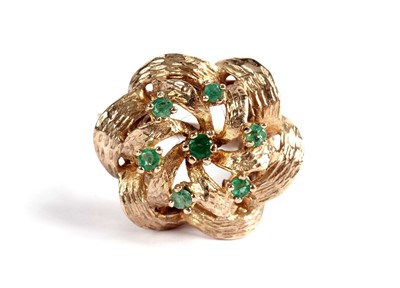 Lot 530 - An emerald cluster dress ring