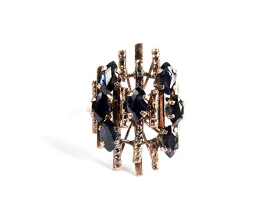 Lot 540 - A sapphire cluster dress ring