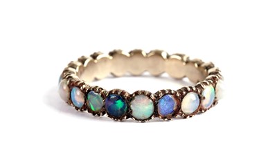 Lot 544 - An opal eternity ring