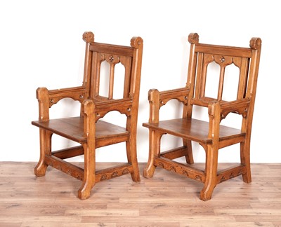 Lot 24 - A pair of carved oak gothic revival ecclesiastical armchairs