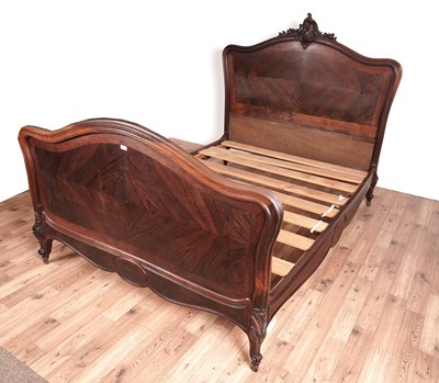 Lot 127 - An early 20th Century rosewood double bed with arched headboard