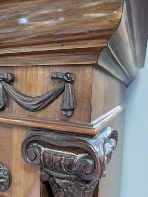 Lot 668 - A large and impressive carved walnut Elliott quarter chiming longcase clock