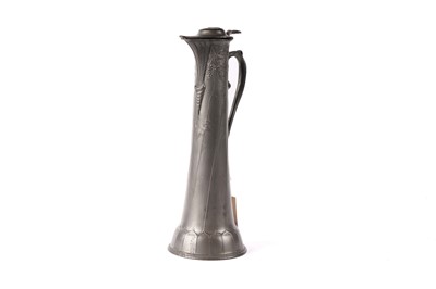 Lot 645 - An Art Nouveau pewter claret jug