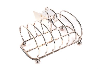 Lot 597 - An Edwardian silver seven bar toast rack