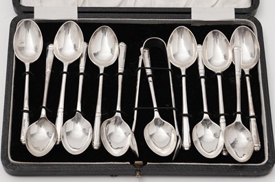 Lot 618 - A set of twelve silver teaspoons and a pair of sugar tongs