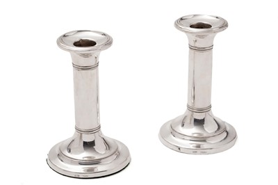 Lot 635 - A pair of silver candlesticks