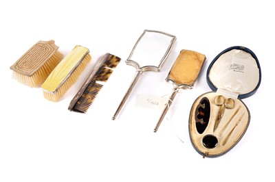 Lot 625 - Two George V hand mirrors and a selection of dressing table items