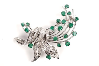 Lot 1122 - An emerald and diamond floral spray brooch