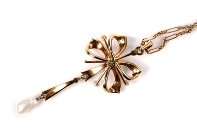 Lot 1123 - An Edwardian diamond and pearl pendant