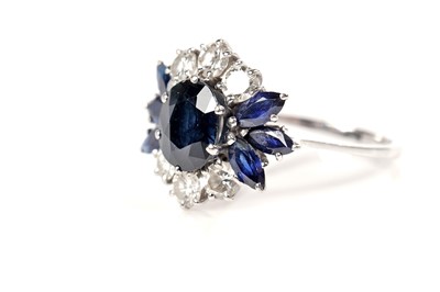 Lot 1124 - A sapphire and diamond dress ring