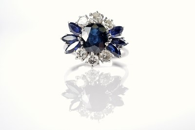 Lot 1124 - A sapphire and diamond dress ring