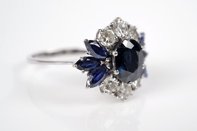 Lot 1124 - A sapphire and diamond dress ring