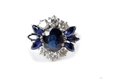 Lot 1124 - A sapphire and diamond dress ring