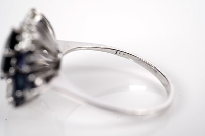 Lot 1124 - A sapphire and diamond dress ring
