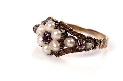 Lot 1125 - A Victorian ruby and seed pearl mourning ring