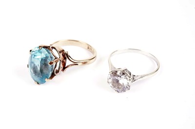 Lot 553 - An aquamarine dress ring; and a solitaire dress ring