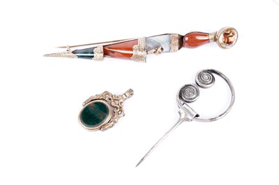 Lot 730 - A Victorian plaid brooch; an Iona silver brooch by Alexander Ritchie; and a swivel fob