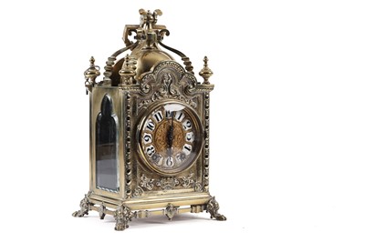 Lot 199 - A 19th Century embossed brass mantel clock