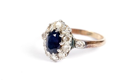Lot 504 - A sapphire and diamond cluster ring