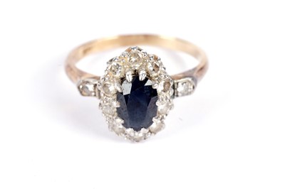 Lot 504 - A sapphire and diamond cluster ring