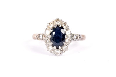 Lot 504 - A sapphire and diamond cluster ring