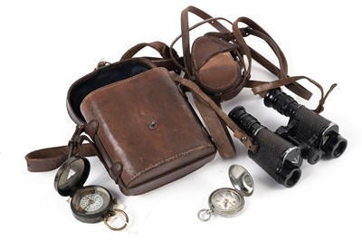 Lot 462 - Two military compasses; and a pair of binoculars