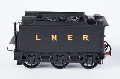 Lot 18 - A metal kit-built 0-gauge 4-4-0 locomotive and six-wheel tender