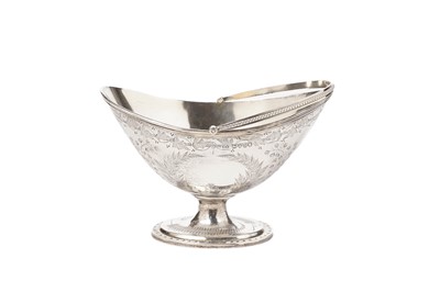 Lot 1487 - A Victorian silver swing-handled sugar basket