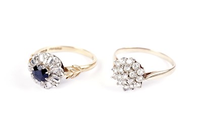 Lot 560 - A diamond and sapphire cluster ring; and another cluster ring
