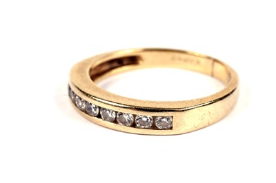 Lot 562 - A diamond half hoop eternity ring